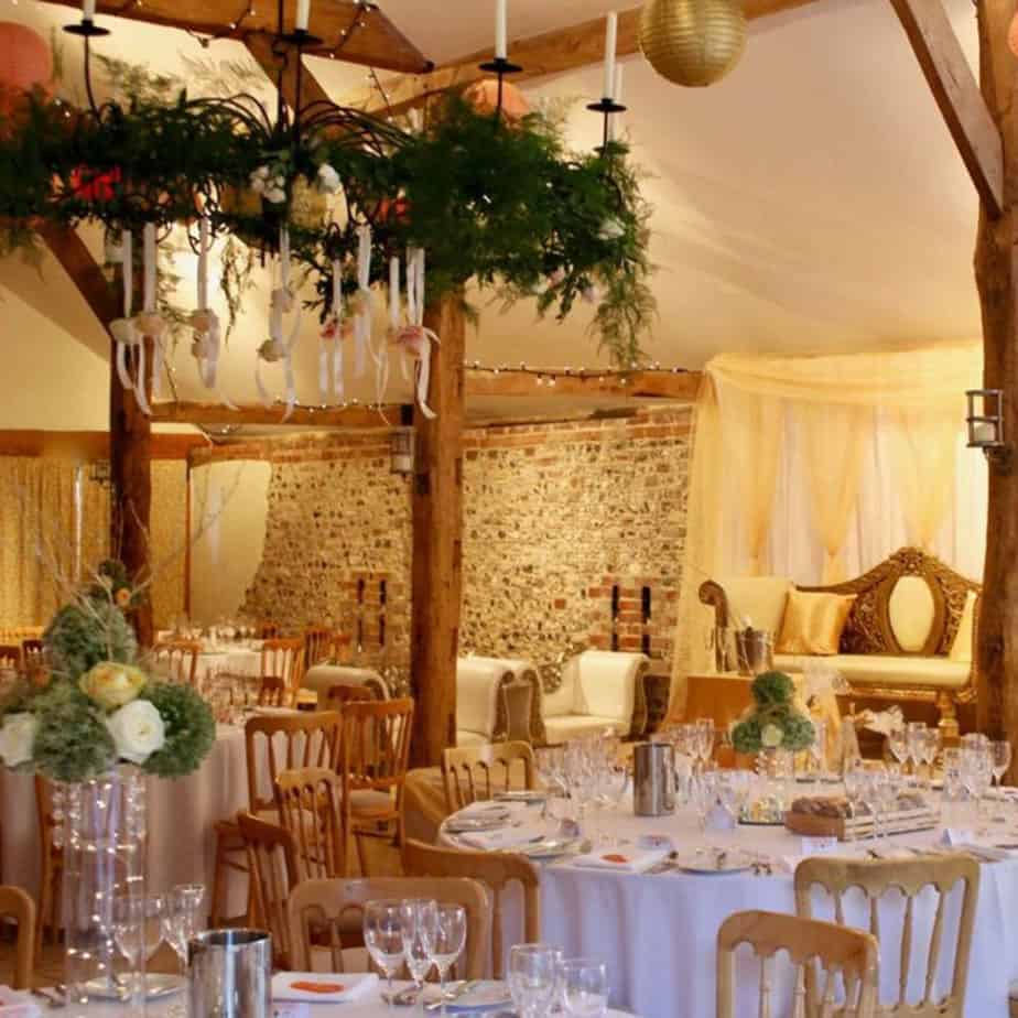 upwaltham-barns-chichester-stage-hire-backdrop-with-gold-swags Hire Your Day wedding venue styling
